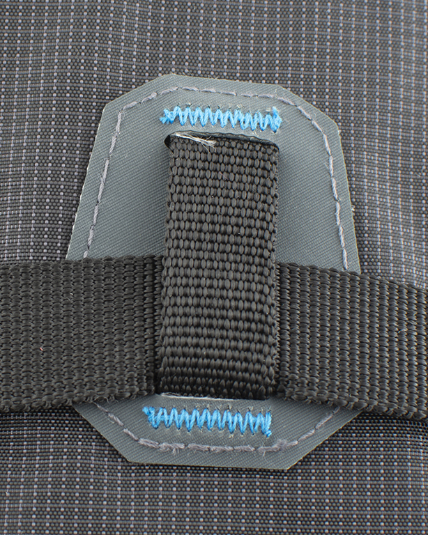 Durable metal hooks and Hypalon-based straps on the front of the backpack for diagonal ski fixation.