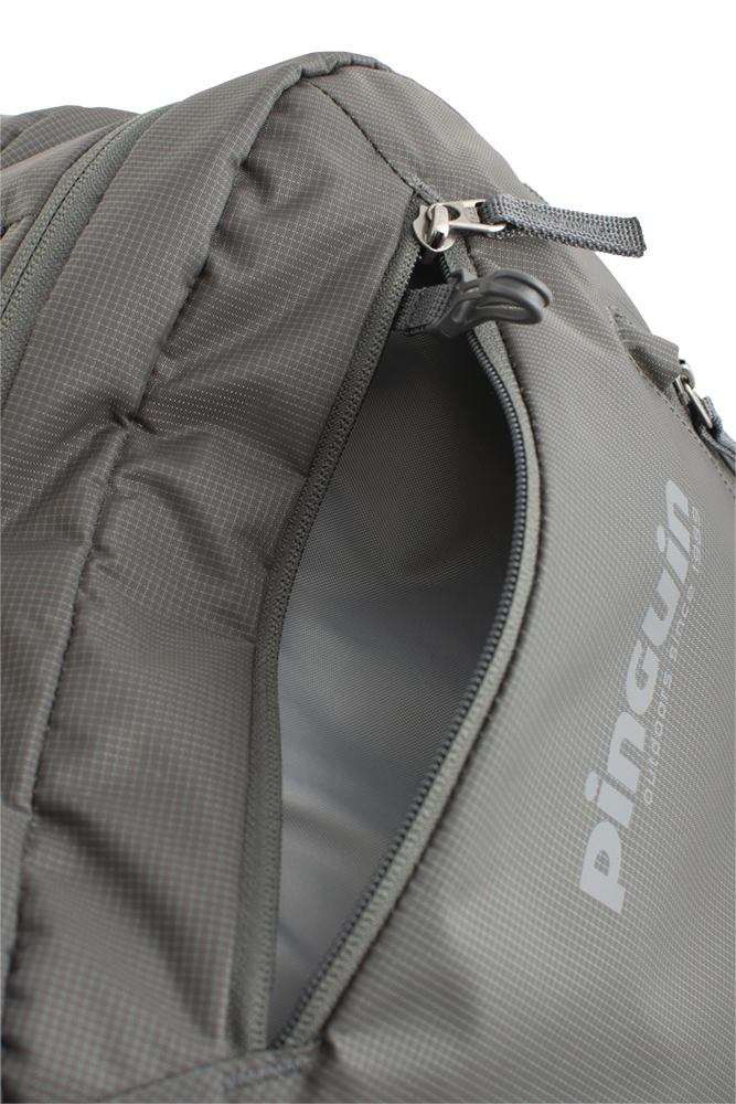 Integral 30 - Zipped pocket with keychain carabiner on the top of the backpack.
